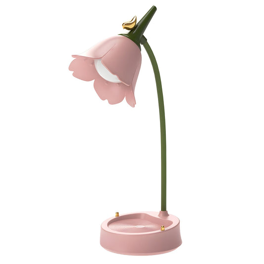Blooming Flower LED Desk Lamp in pink - flower-shaped petal shade with gold bird, green gooseneck stem, and round tray base, on white background